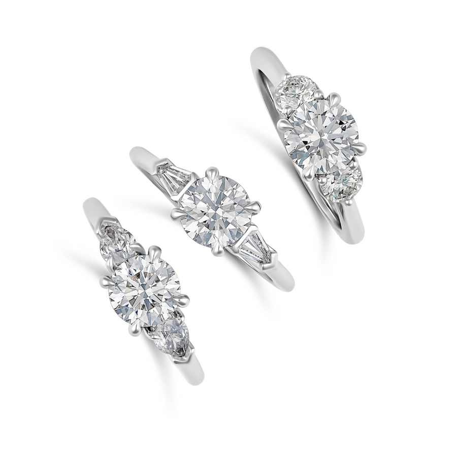 Classic Three Stone Round Brilliant Cut Diamond Engagement Ring with Tapered Baguettes | Platinum